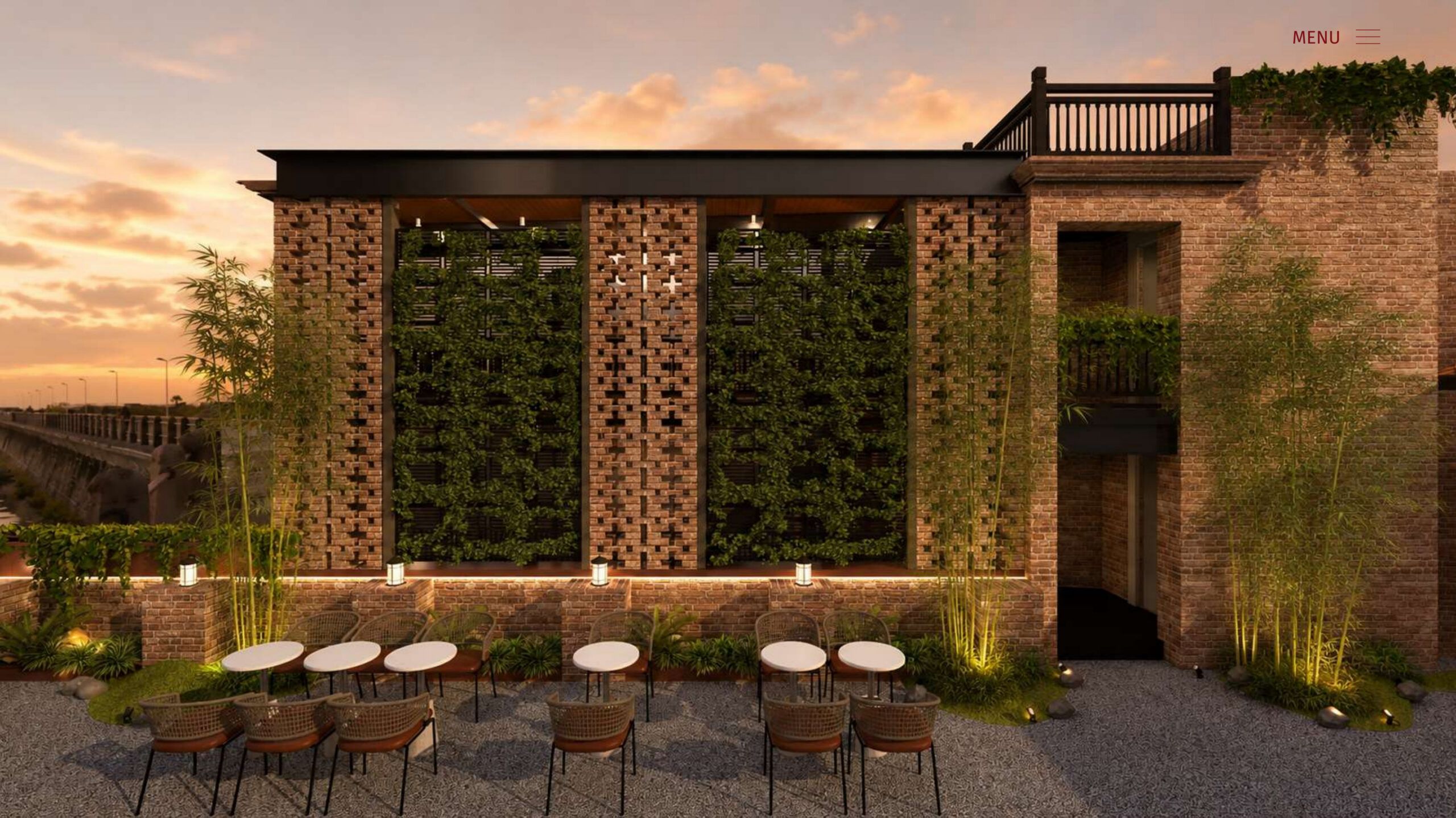 Licchavi House rooftop cafe at dusk, tables before a brick and lattice facade with a green wall