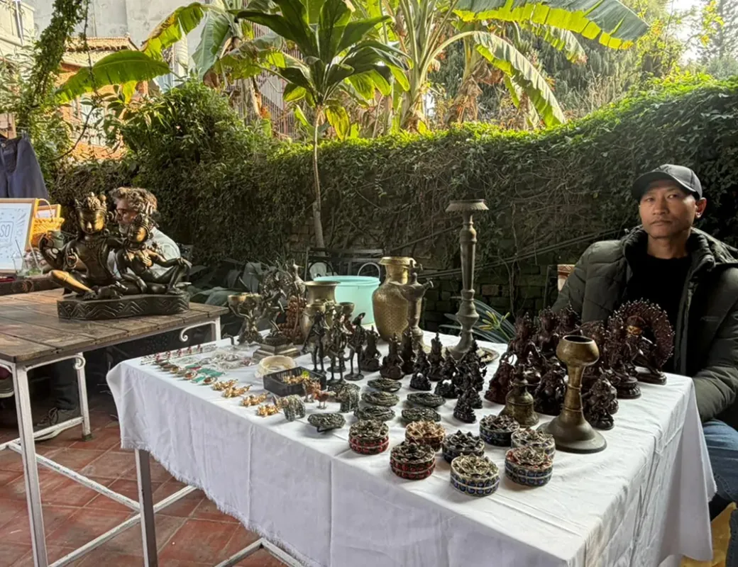 Handcrafted metal statues on display at a garden market