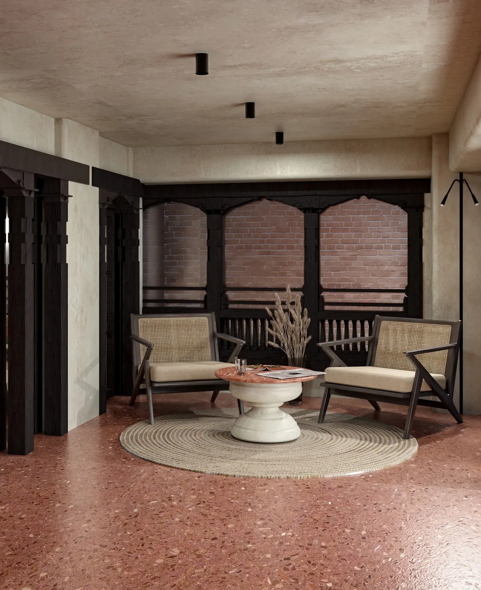 Lounge with two armchairs on a terrazzo floor before carved timber windows